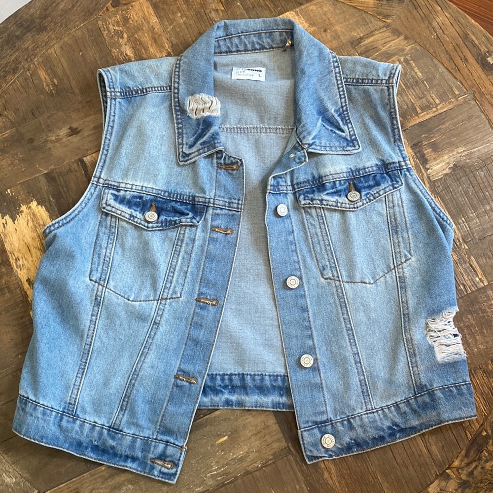 Distressed denim vest